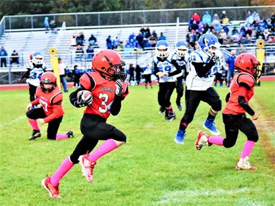 Holly Stampede Football Player Running with Football